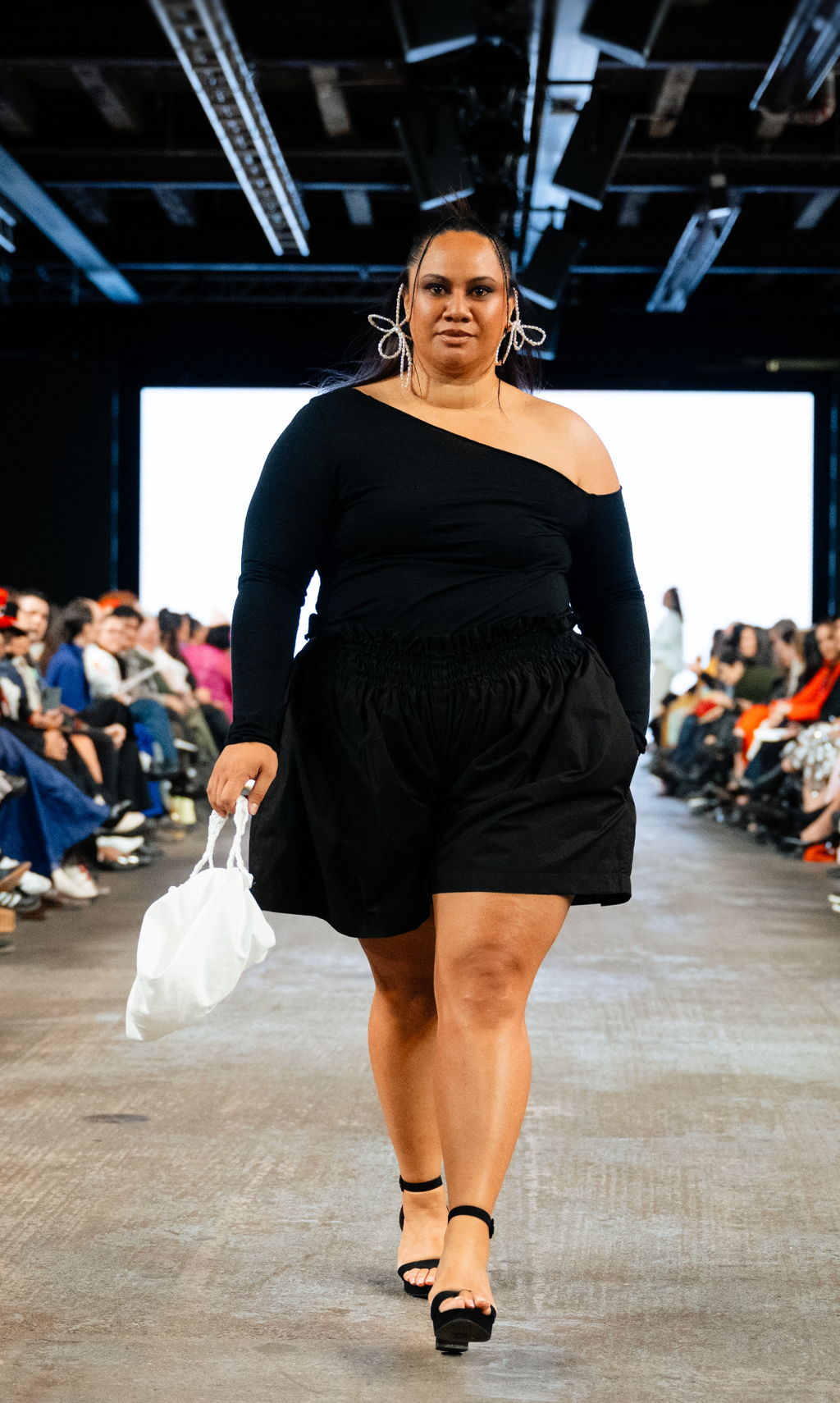 Woman in black gathered waist shorts