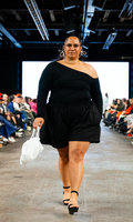 Woman in black gathered waist shorts